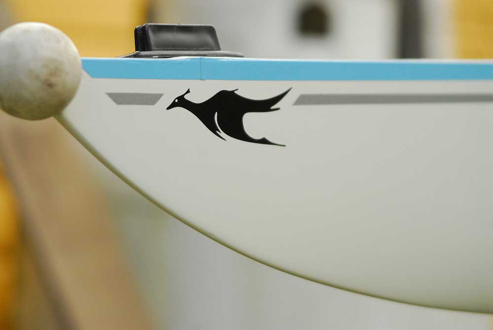 Refinish hull of rowing shell with decal. A close-up look at our craftsmen at work – Structural and cosmetic rowing shell repair