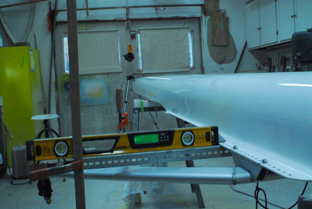 Laser fin installation of a rowing shell. For laser fin alignment the rowing shell must be leveled port to stern.
