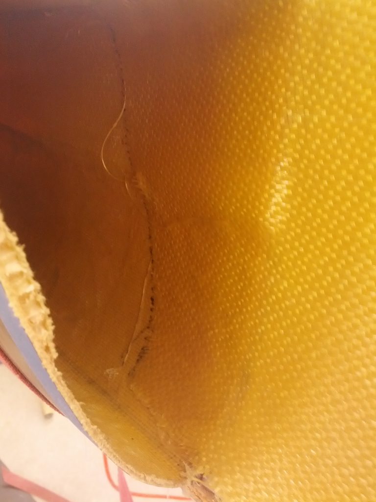 bow repair: Swift Quad Bow Replacement -The Kevlar outer skin overlapping the existing hull. 