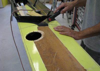 rowing shell repair: Cutting out damaged deck- racing shell restoration